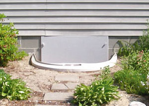 Rigid plastic crawl space access well installed in a Brandon crawl space