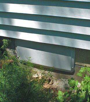 A gray crawl space vent cover in Lafayette