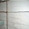 Severe foundation damage from a long crack in a bucking wall of a Shreveport home.