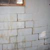 A cracked foundation wall near a window in a Laurel home