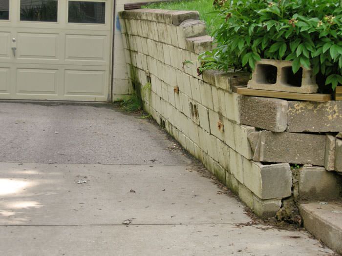 a failing retaining wall around a driveway in Jackson