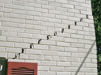 Stair-step cracks showing in a home foundation in Hammond