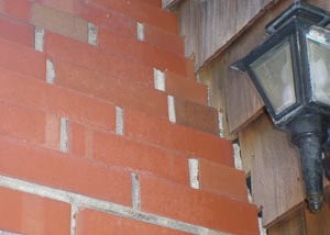a repaired chimney in Lafayette that had shown serious foundation damage and was repaired with a helical pier system.
