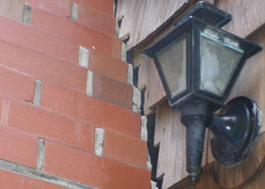 A tilting chimney in Lafayette showing serious foundation damage.