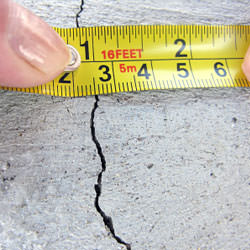 A crack in a poured concrete wall that's showing a normal crack during curing in Yazoo City