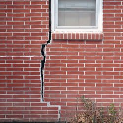 A foundation with a large crack that's wider at the top than on the bottom in Florence