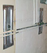 A foundation wall anchor system used to repair a basement wall in Hammond