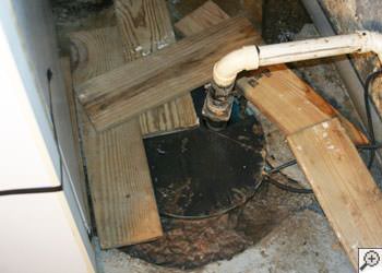 An ugly, clogged sump pump system in Meridian, Mississippi & Louisiana